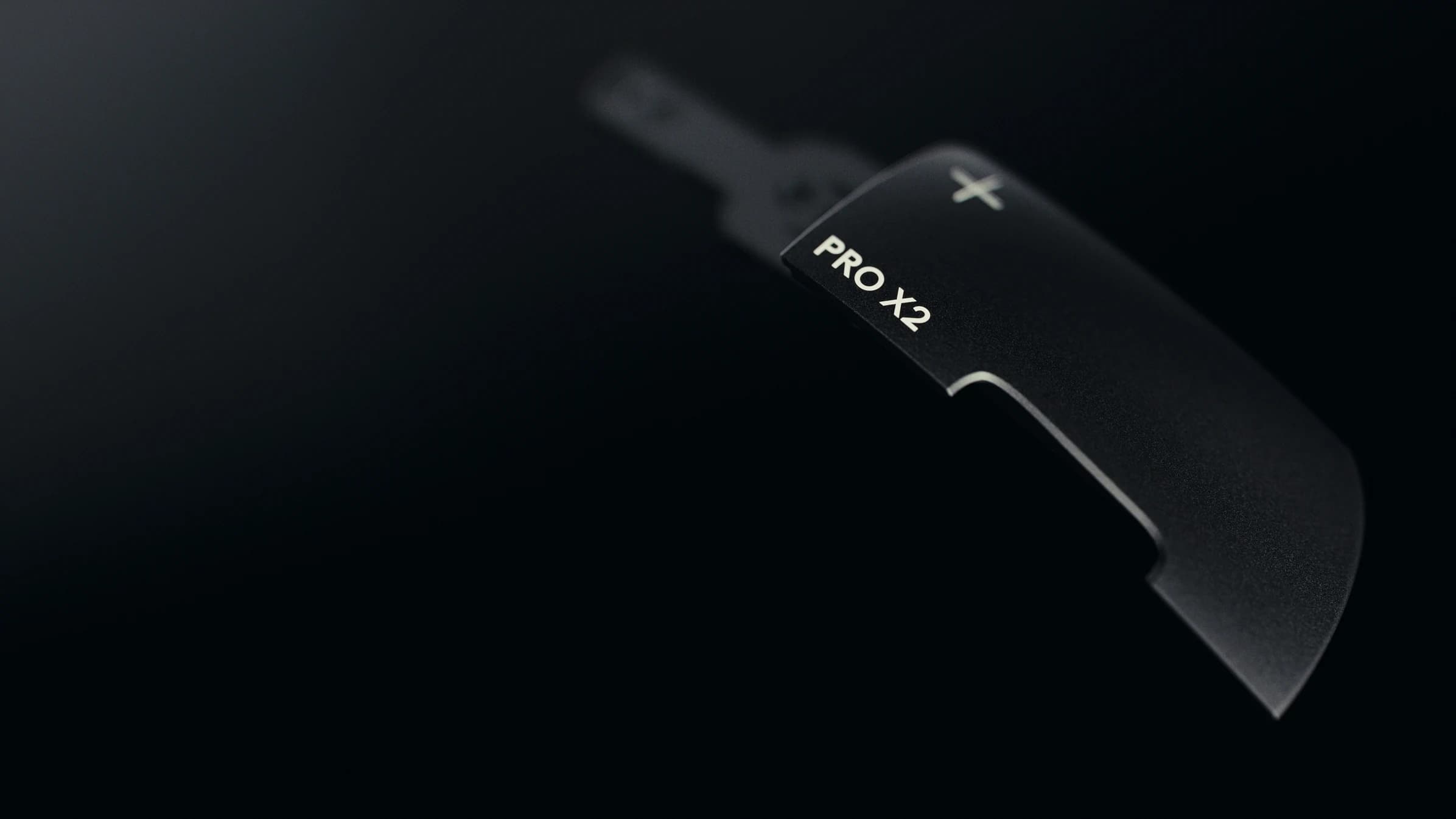 Close-up of the black PRO X2 button surface and precision detailing
